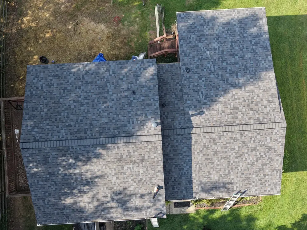 The same house from above with new multi-tone architectural shingles on every slope